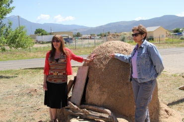 Pati and Terri with New Mexico's only FDA approved horno (traditional adobe oven), at the Taos Food Center