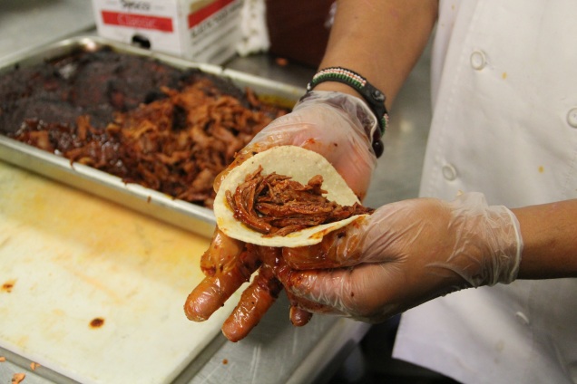 Chef Franco Lee preparing tacos from churro sheep meat tacos