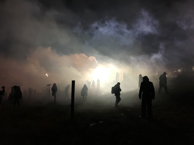 tear gas, launched at water protectors. photo by Elizabeth Hoover